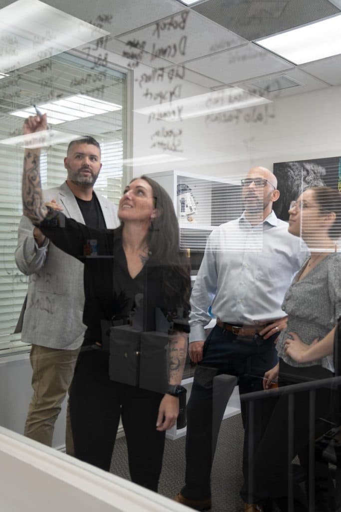 Blue Water Marketing team strategy session at Stuart, Florida office